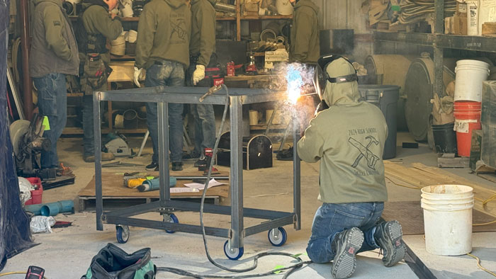 <b>A member of the team from Mediapolis High School welds the frame of a shop cart the students built for the 2024 High Schoo Skills Challenge hosted and organized by Carl A. Nelson & Company at its warehouse and yard in Burlington, Iowa. </b>(CANCO)