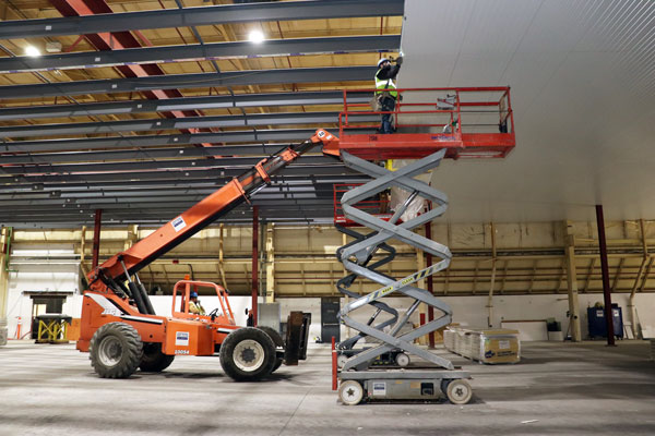 <b>Carl A. Nelson & Company construction crews install insulated metal panels in the Western Smokehouse Partners snack stick production facility in Burlington, Iowa. More than 1,600 of the insulated panels were obtained for use in the project.</b> <i>CANCO photo</i>